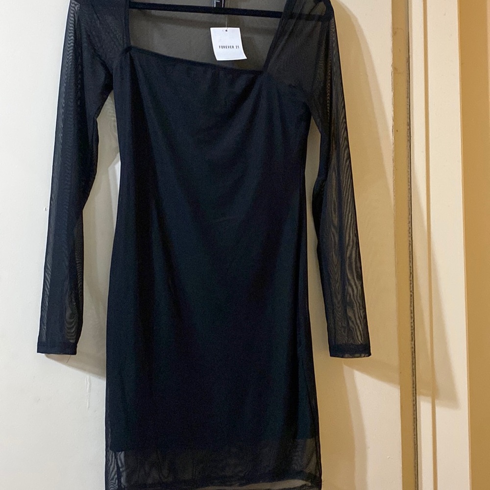 never worn still has original tags , stretchy, mesh long sleeve